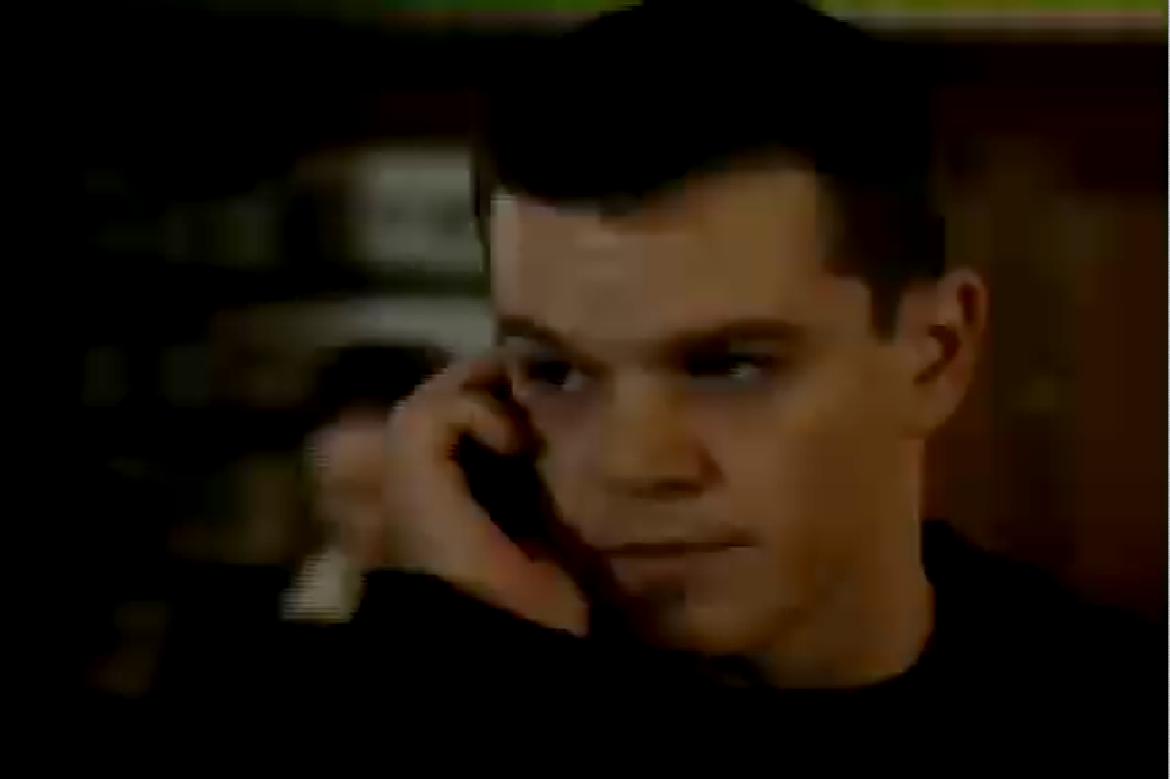 Jason Bourne using a cell phone
