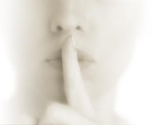 Women making hush gesture